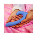 Cute Little Fuckers Jix Vibrator Periwinkle being held in hands, resting on a soft pink blanket.