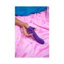 Cute Little Fuckers Shimmer Moonlight G-Spot Vibrator in hand on soft pink blanket.