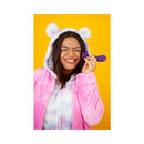 Cute Little Fuckers Shimmer Moonlight G-Spot Vibrator held by a smiling woman in a cozy outfit against a yellow background.