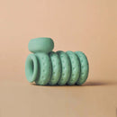 Ohnut Vibrating Penis Ring Jade showcased on a neutral background, highlighting its unique design and texture.