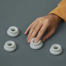 Ohnut Depth-Limiting Rings 4-Pack Jade displayed with a hand reaching for one ring on a gray background.