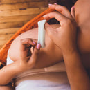 Person holding Ohnut Depth-Limiting Rings 4-Pack Jade, designed for comfort and intimacy.