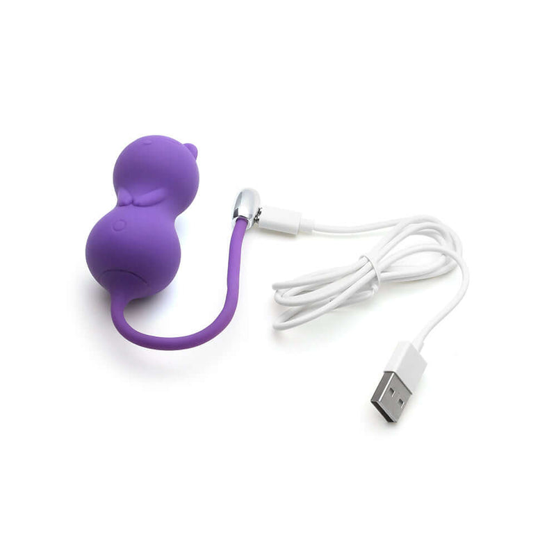 Emojibator Kitty Cat Kegel Ball Vibrator in purple with USB charging cable for pleasurable experiences.