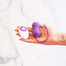Emojibator Kitty Cat Kegel Ball Vibrator in hand, featuring cute cat design and vibrant purple color.