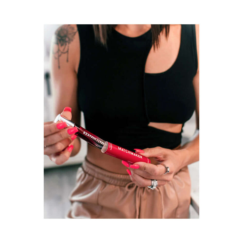 Eye of Love Matchmaker Red Diamond Attract Him Pheromone Parfum 10 ml displayed by a woman holding the product.