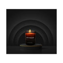 Eye of Love Matchmaker Black Diamond Attract Her Massage Candle burning on a sleek black display.