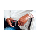 Eye of Love Romantic Attract Her Pheromone Massage Candle held in hands, showcasing luxury and intimacy.