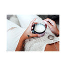 Eye of Love Morning Glow Attract Him Pheromone Massage Candle in a person's hands