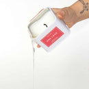 Eye of Love One Love Attract Him Pheromone Massage Candle pouring candle wax from container.