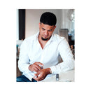 Man applying Eye of Love Romantic Attract Her Pheromone Parfum 10 ml in a stylish setting.