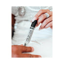 Eye of Love Romantic Attract Her Pheromone Parfum 10 ml held by a hand with polished nails.
