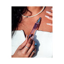 Eye of Love Morning Glow Attract Him Pheromone Parfum 10 ml bottle held by a woman with stylish nails and jewelry.