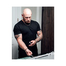 Man applying Eye of Love Matchmaker Black Diamond Attract Her Parfum 1 Oz in front of a bathroom mirror.