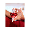 Eye of Love Matchmaker Red Diamond Attract Him Parfum 1 Oz displayed in a hand with manicured nails.
