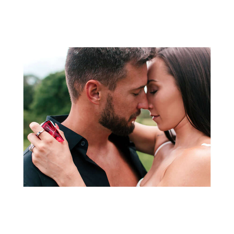 Eye of Love Matchmaker Red Diamond Attract Him Parfum 1 Oz, couple sharing an intimate moment with fragrance.