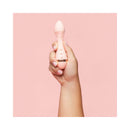 Hand holding the VUSH Rose 2 Precision Bullet Vibrator against a pink background.