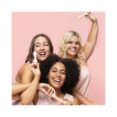 Three women joyfully holding VUSH Rose 2 Precision Bullet Vibrators in a pink background, embracing self-love.