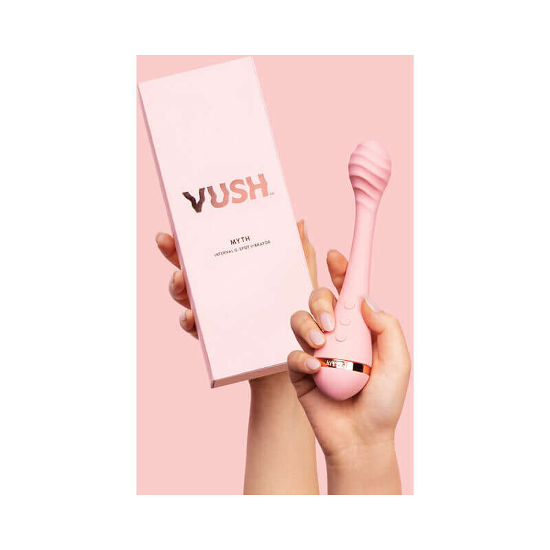 VUSH Myth Internal G-Spot Vibrator held next to its elegant packaging, showcasing its unique design and color.