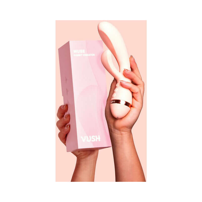 VUSH Muse Rabbit Vibrator held in hand with packaging, showcasing its design and dual stimulation features.
