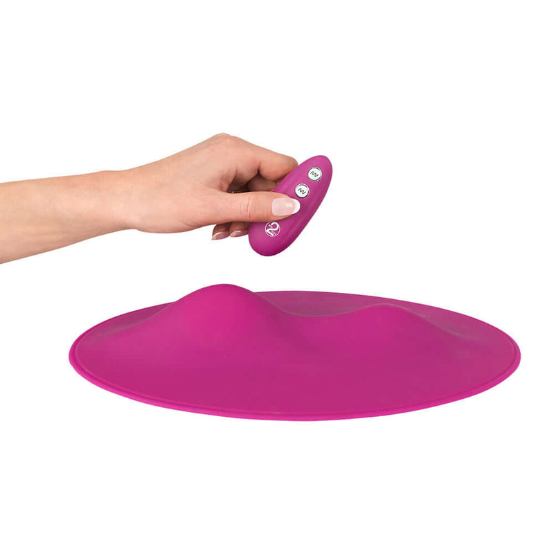 VibePad Hands Free External Vibrator with remote control, showcasing its elegant design and body-safe silicone.