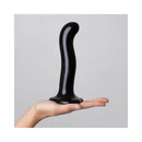 Strap-On-Me P&G-Spot Silicone Dildo Medium Black held in a hand, showcasing its ergonomic design and smooth surface.
