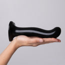 Strap-On-Me P&G-Spot Silicone Dildo Large Black held in hand showing its smooth design.