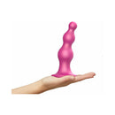 Strap-On-Me Dildo Plug Beads Large Raspberry in a hand, showcasing its ergonomic design and vibrant color.