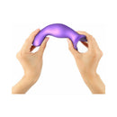 Hands holding the Strap-on-me Dildo Plug Curvy Small Purple, showcasing its flexible design and ergonomic shape.
