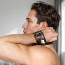 Strict Leather Wrist to Neck Restraint featuring leather cuffs and a collar on a model.