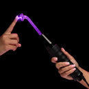 User experiencing the Zeus Twilight Violet Wand Kit 110V with a glass electrode glowing violet light.