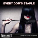 Strict Leather Short Riding Crop held by a dominatrix with long dark hair and red lipstick, representing confident play.
