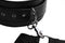 Adjustable black leather thigh harness with metal clips and grommets for bondage restraint system.