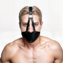 STRICT Mouth Harness with Ball Gag Black worn by a model, showcasing its design for dominance and submission play.