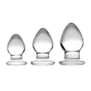 Triplets 3 Piece Glass Anal Plug Kit showcasing three graduated glass plugs for comfortable anal training.