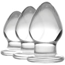 Triplets 3 Piece Glass Anal Plug Kit showcasing three sleek, graduated glass plugs for progressive anal training.