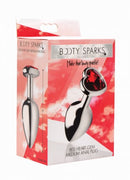 Booty Sparks Red Heart Gem Medium Anal Plug packaging with a heart-shaped gem and polished metal design.