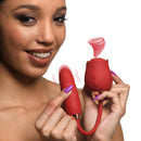 Person holding the Bloomgasm 10X Romping Rose Suction and Thrusting Vibrator, showcasing its design and functions.