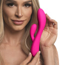 Model showcasing the 10X Flexible Silicone Rabbit Vibrator Pink for dual stimulation and body-safe pleasure.
