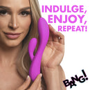 10X Flexible Silicone Rabbit Vibrator Purple held by a model, showcasing its sleek design for pleasure.