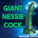 Giant Nessie Cock, a green silicone dildo inspired by the Cockness Monster Lake Creature design.