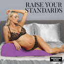 Model using the Contoured Love Cushion Sex Position Pillow Purple to enhance comfort in the bedroom.