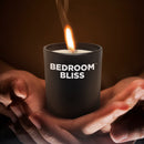 Bedroom Bliss Lover's Massage Candle Vanilla in hands, lit and ready for a sensual massage experience.