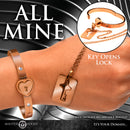 Cuffed Locking Bracelet and Key Necklace Rose Gold with heart lock and key on a hand.