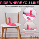 Spin n' Grind Rotating and Vibrating Silicone Sex Grinder on a chair for hands-free pleasure and stimulation.