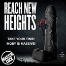 Moby Huge 2 Foot Tall Super Dildo Black displayed with a climber for scale, showcasing its impressive size and features.