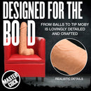 Moby Huge 2 Foot Tall Super Dildo Light displayed on a chair showcasing its realistic details and bold design.