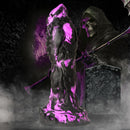 Creature Cocks Grim Silicone Dildo Purple and Black displayed against a spooky, foggy backdrop with a skeletal figure.
