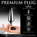 Master Series Butt Slut Metal & Silicone Butt Plug in a hand showcasing premium materials and features.