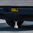 Big Ballers Large Cyber Nuts Truck Hitch Gag Gift Grey hanging from vehicle's hitch, adding humor to the ride.