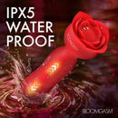 Rose Delight Silicone Thrusting Vibrator in red, showcasing water resistance with IPX5 rating and droplets on premium silicone.